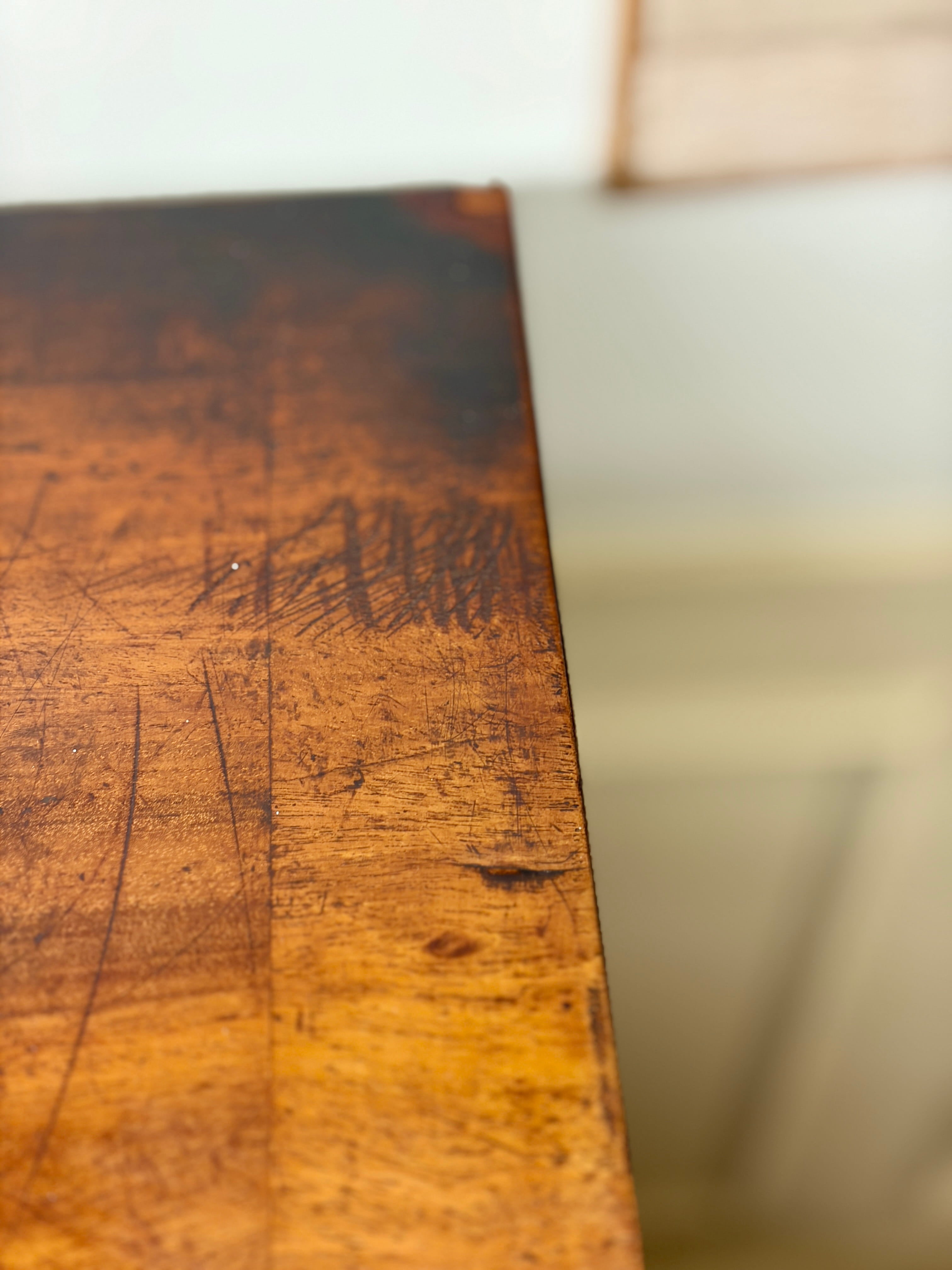 Close-up of a wooden surface with visible grain and texture.