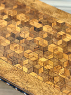 Wooden cutting board with geometric pattern