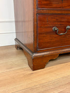 Wooden dresser with a drawer on a wooden floor