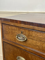 Wooden drawer with brass handle on a white background