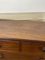 Wooden dresser with two drawers in a room setting