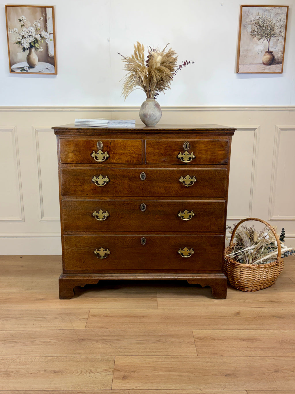 Antique light oak farmhouse chest of drawers with brass handles and patina