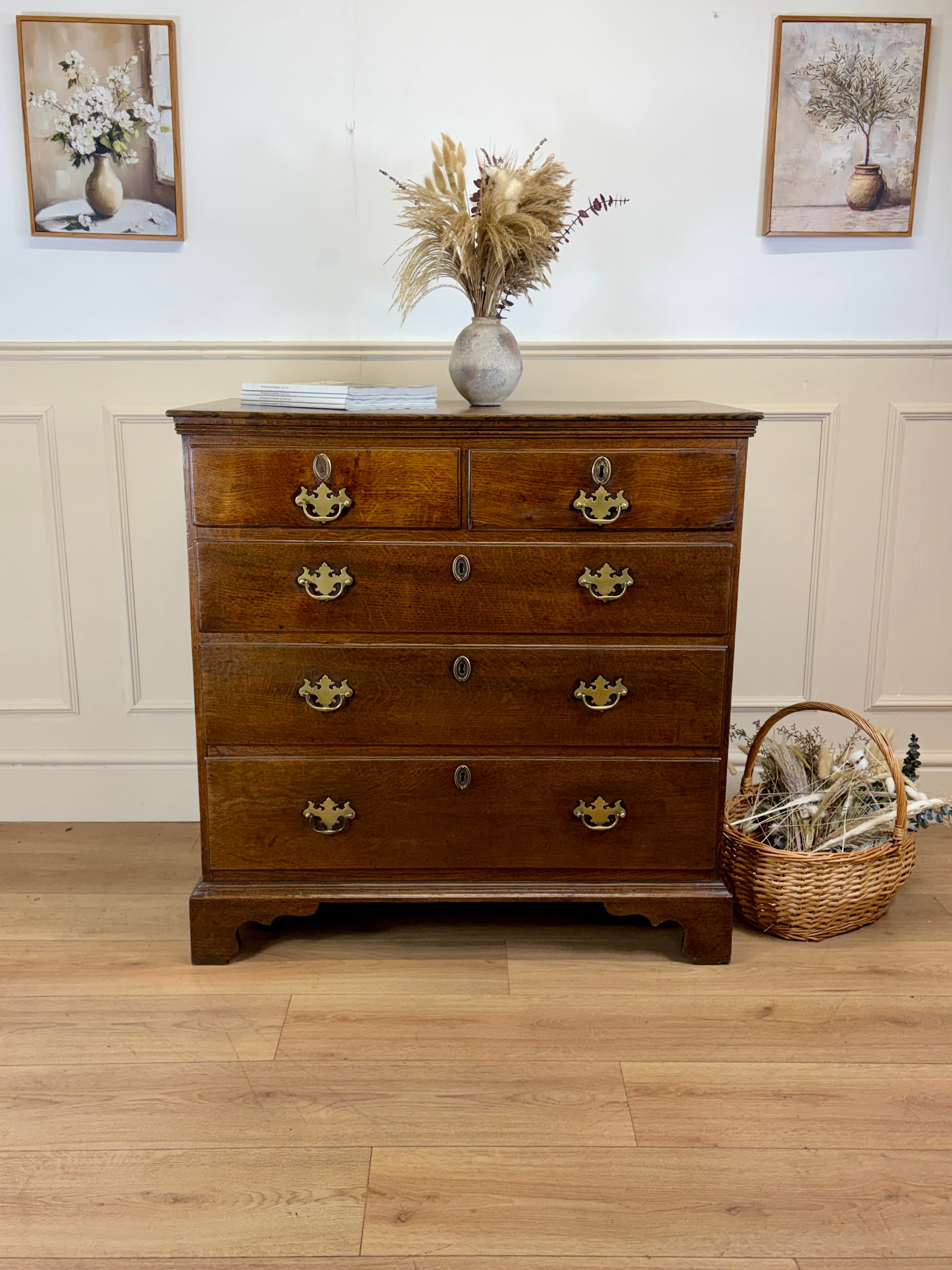 Antique light oak farmhouse chest of drawers with brass handles and patina