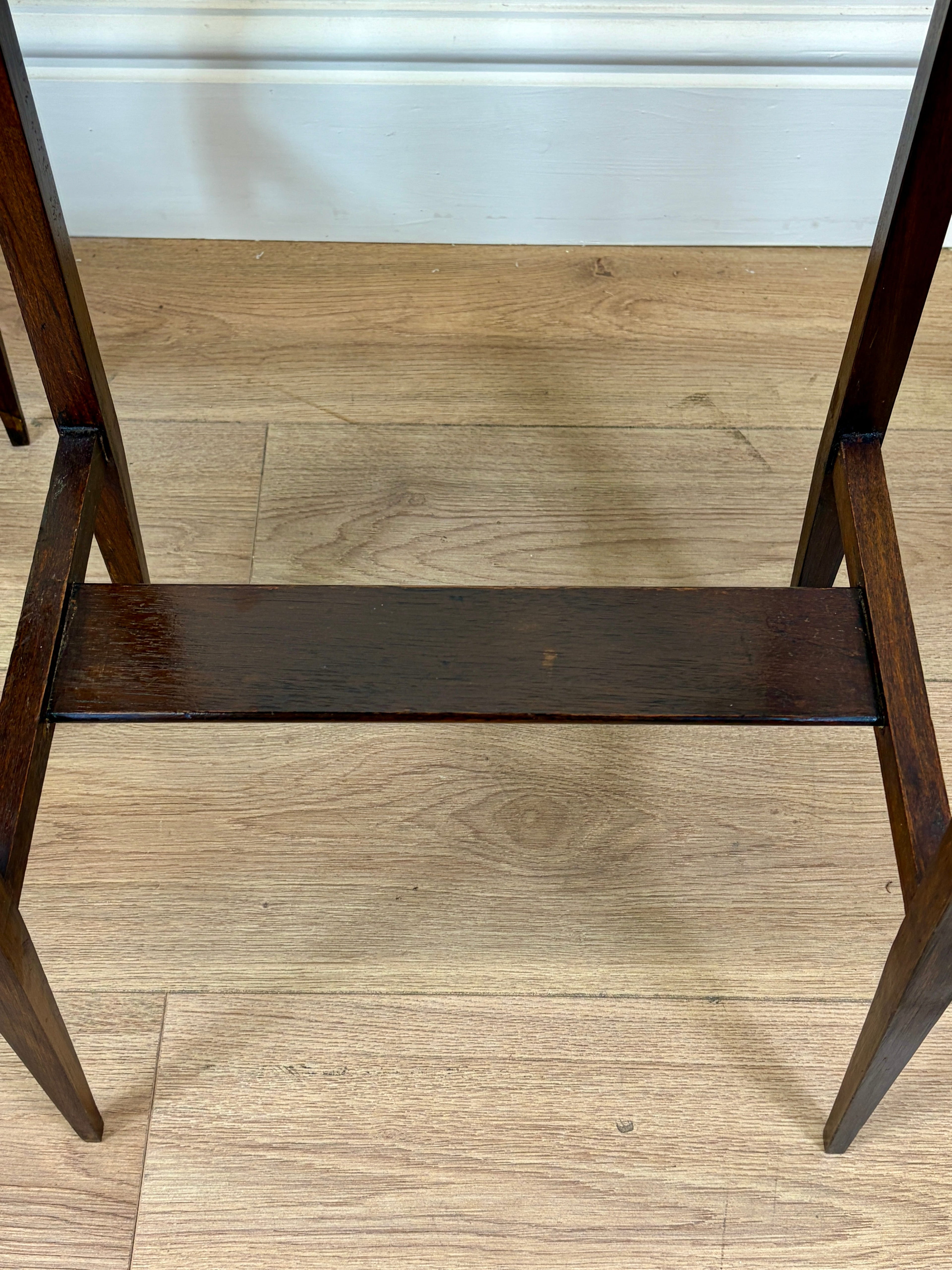 Wooden step stool on a wooden floor