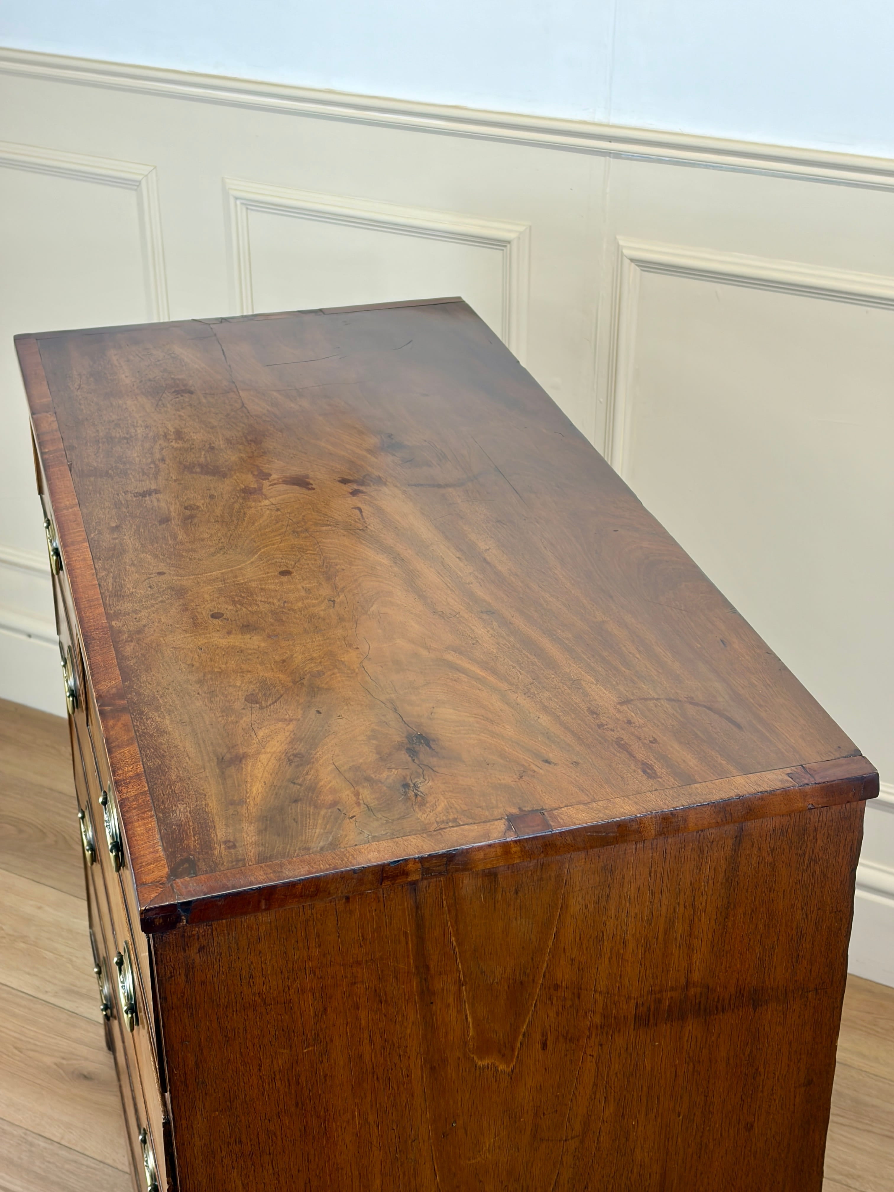 Wooden desk with a wainscoted wall in the background