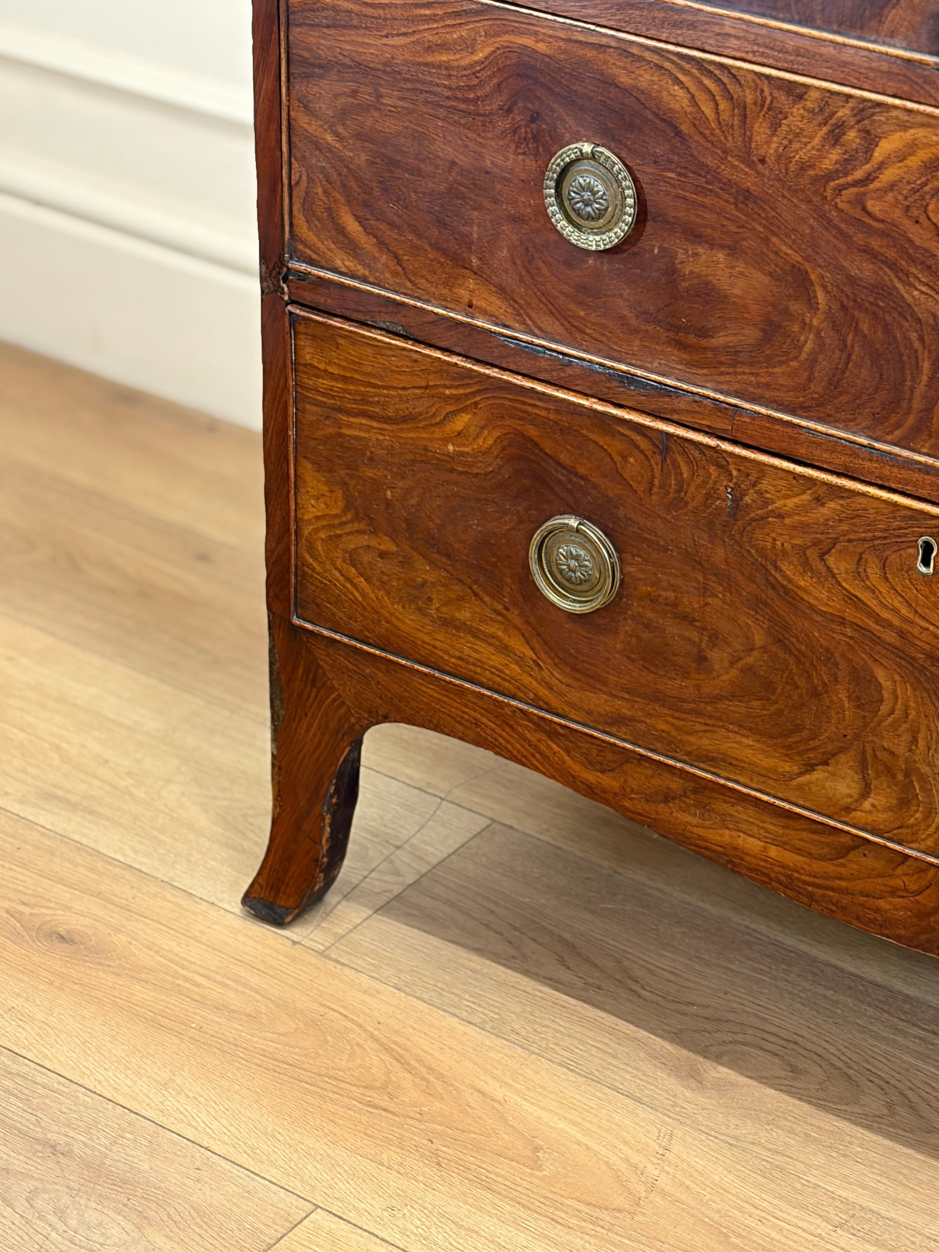 Wooden dresser with decorative buttons on a wooden floor