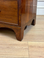 Wooden dresser corner on a wooden floor