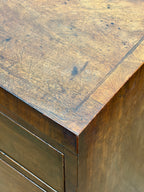 Close-up of a wooden surface with a metal frame